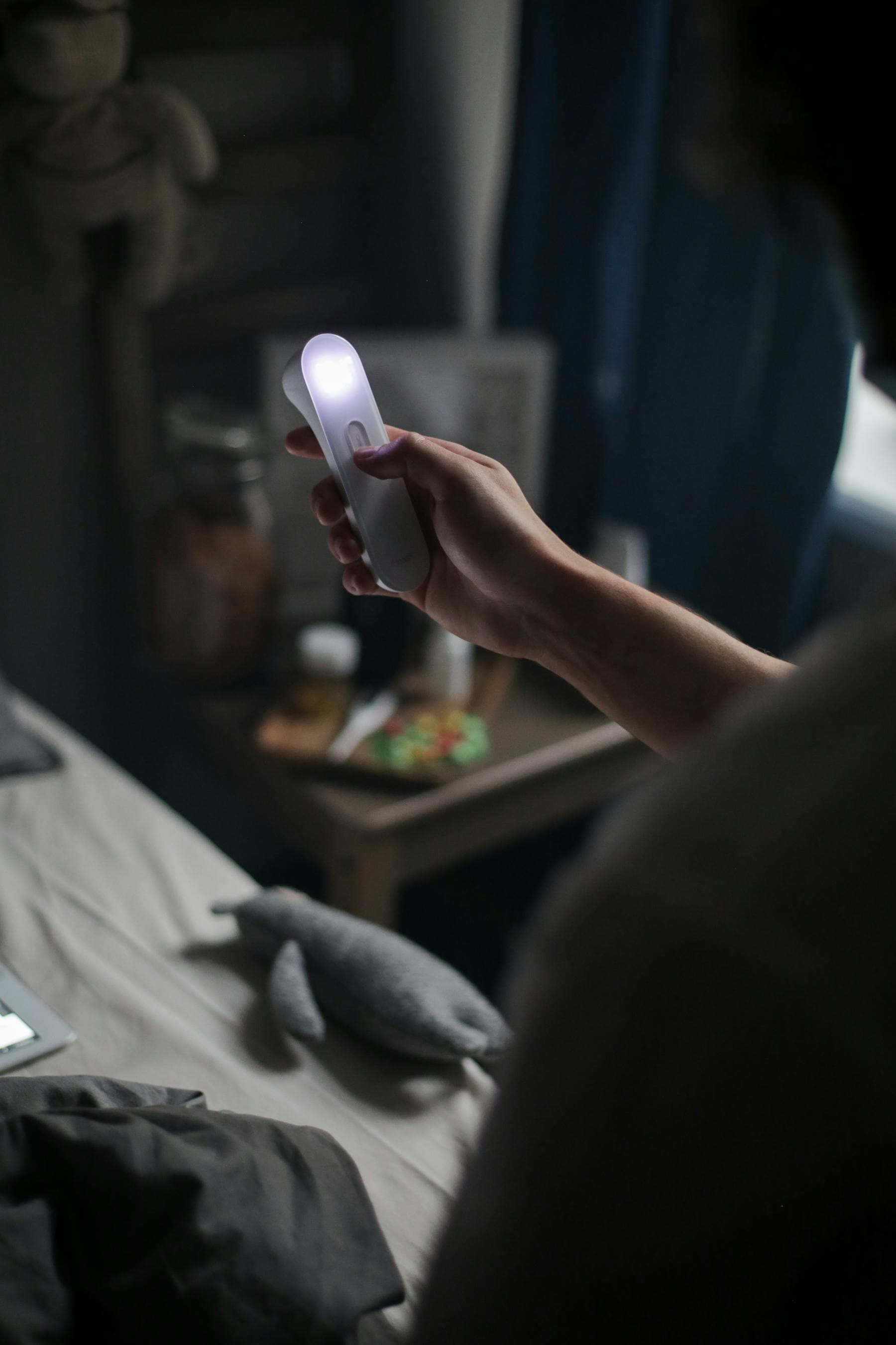 Handheld UV sanitation light in use indoors